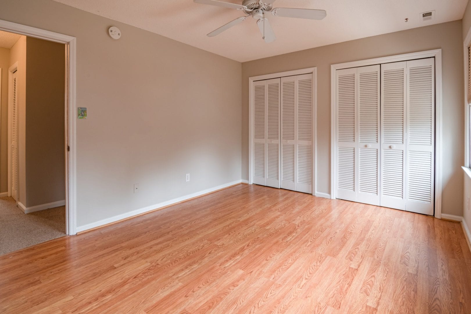 an image showing a room with hardwood floor