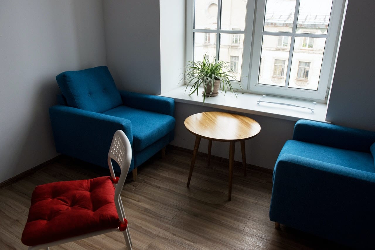 an image that shows a room with chairs and represents laminate floors