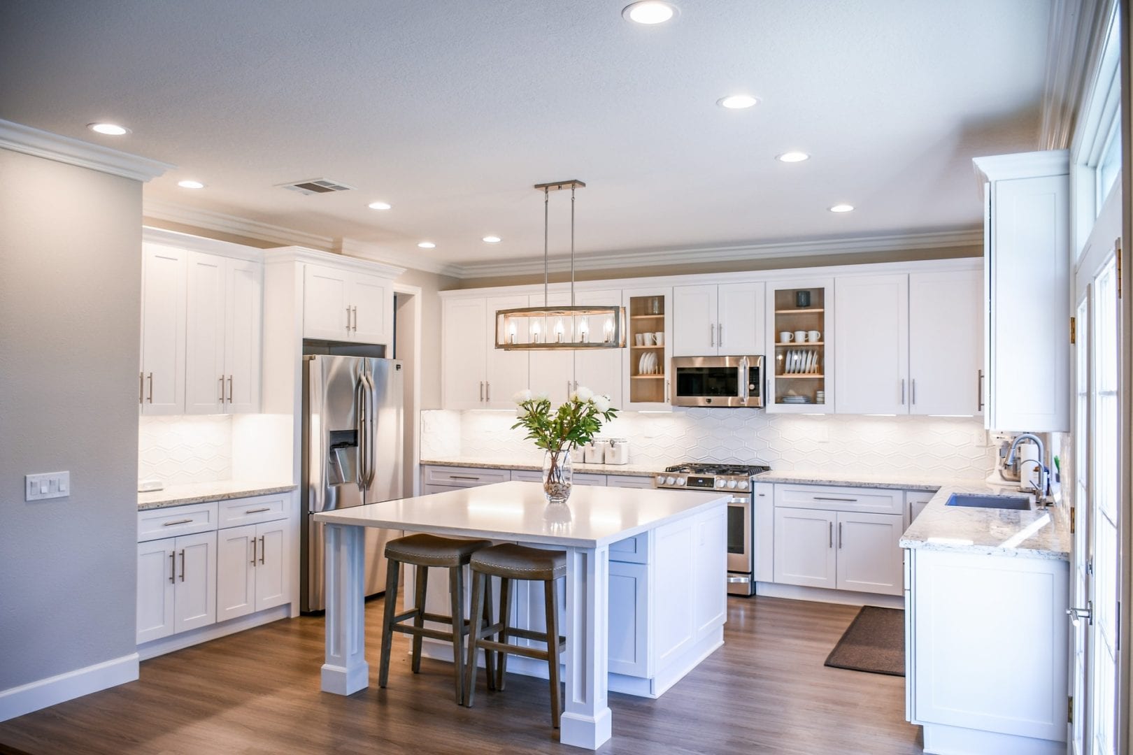 an image showing a kitchen with hardwood floor