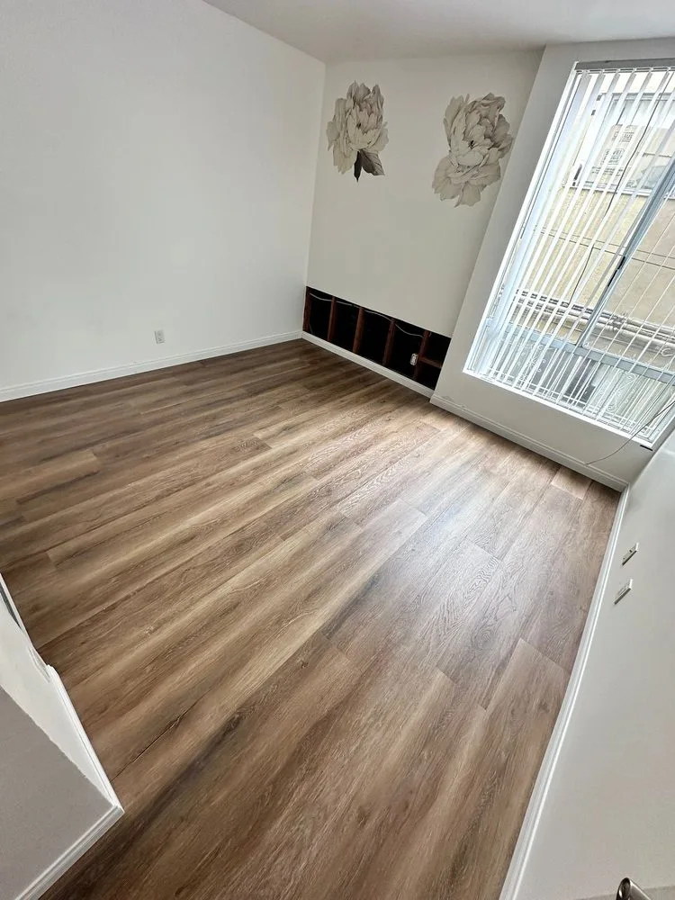 Luxury vinyl plank flooring installation modern wood look residential room