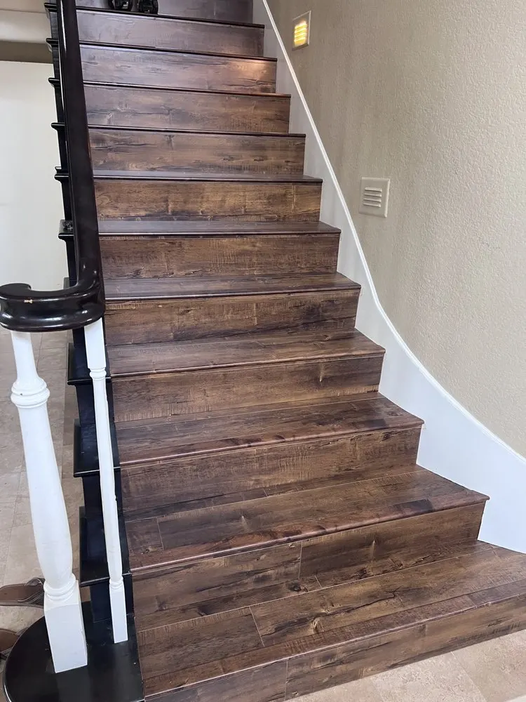 Dark laminate flooring on residential stairs