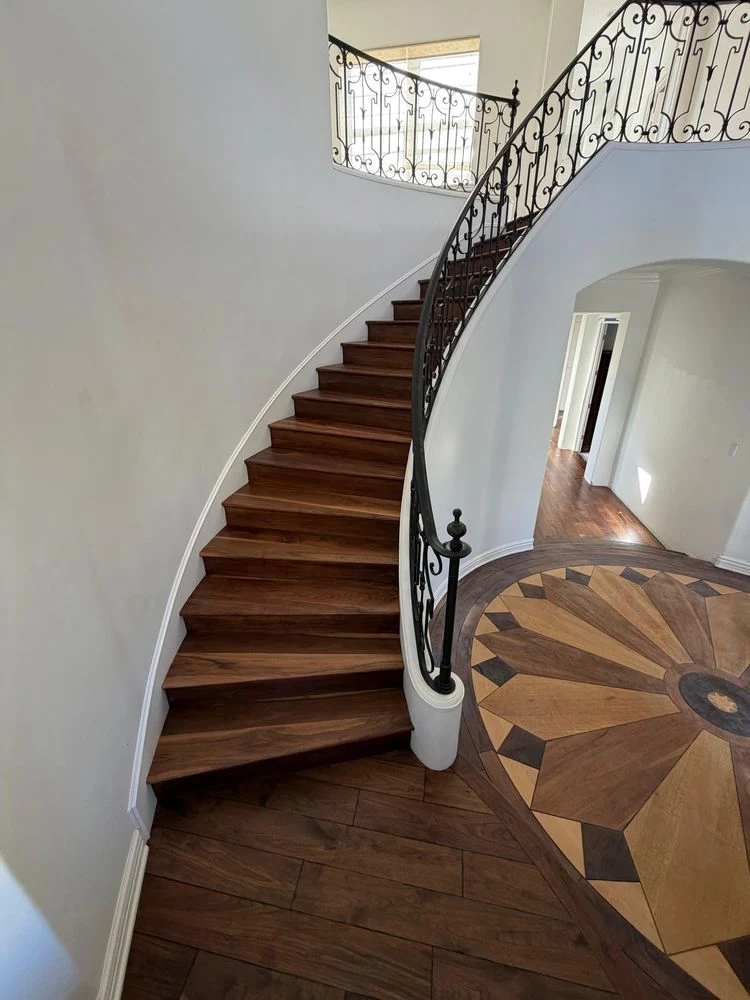 staircase with medium-tone wood treads and white risers in a residential home.