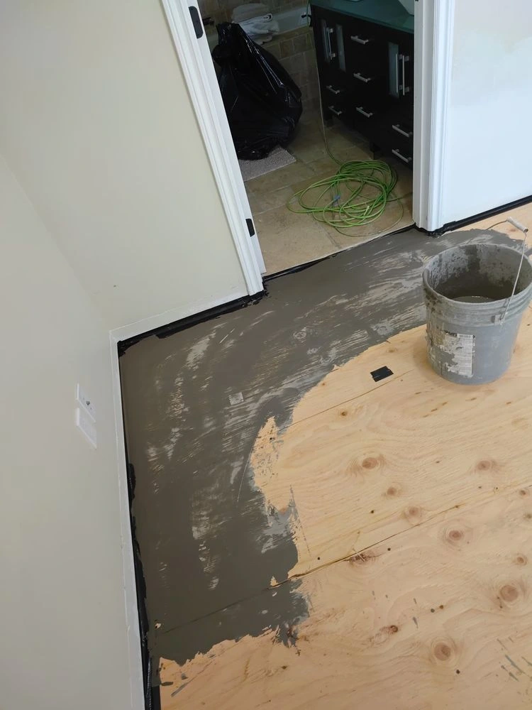 Blackcore laminate flooring installation with freshly leveled subfloor in Thousand Oaks